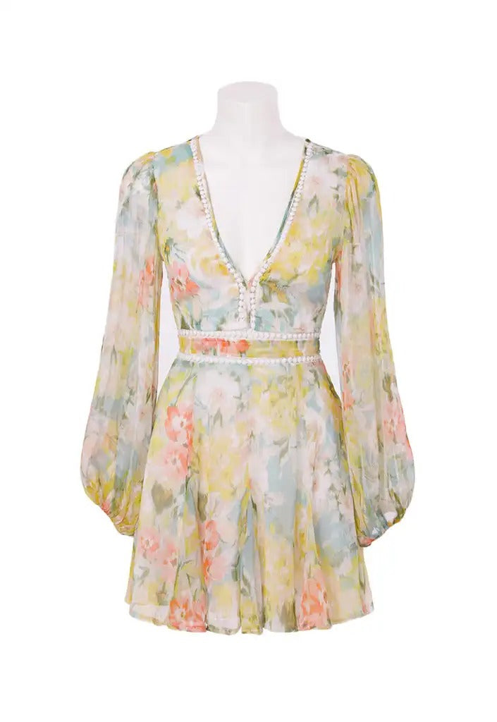 Pastel floral mini dress with deep V neckline and long sleeves