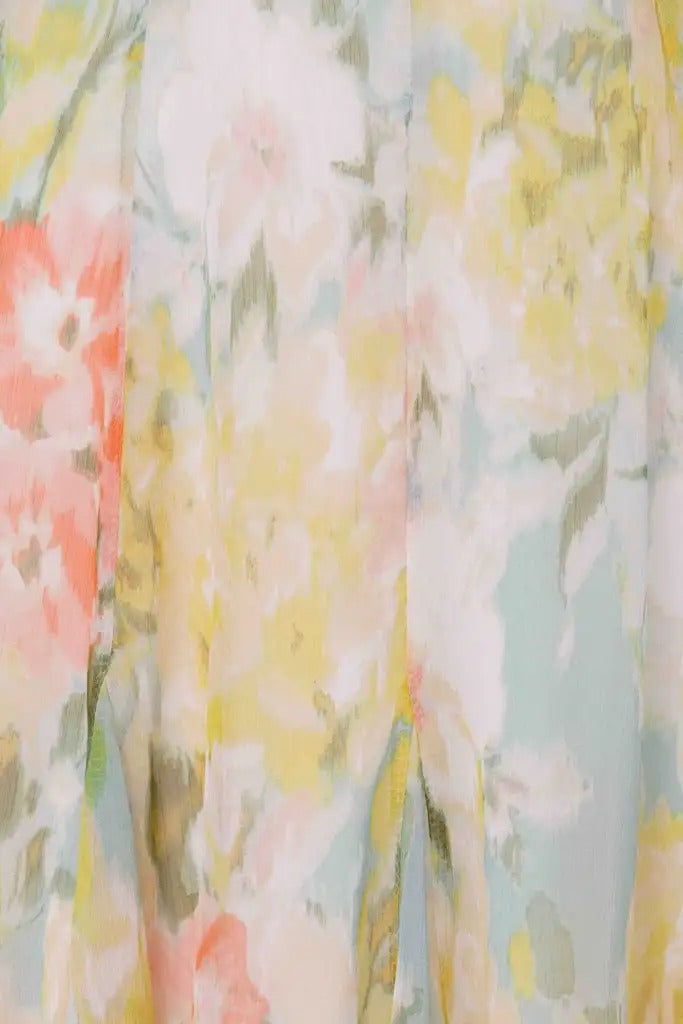 Pastel floral mini dress with deep V neckline and long sleeves